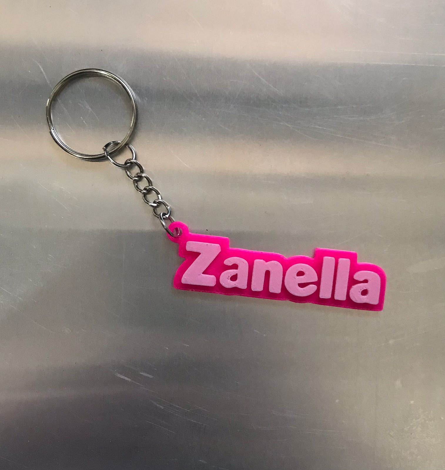 Llavero ZANELLA rosado flúor con rosa